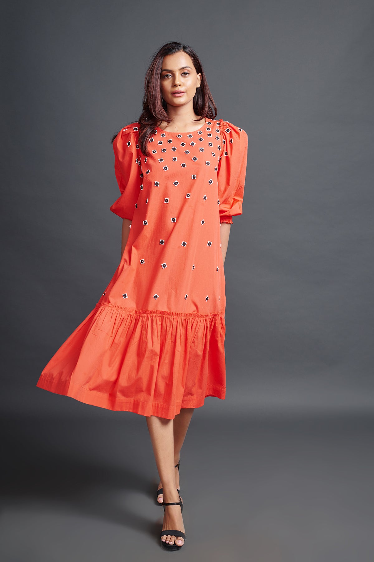 Image of ORANGE GATHERED HEM DRESS IN COTTON BASE WITH CUTWORK EMBROIDERY. From savoirfashions.com