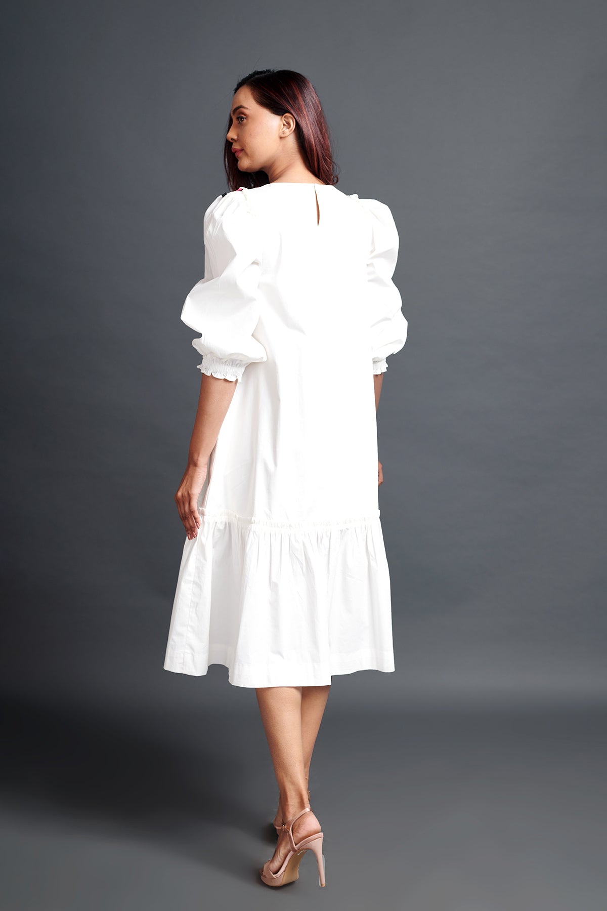 Image of WHITE GATHERED HEM DRESS IN COTTON BASE WITH CUTWORK EMBROIDERY. From savoirfashions.com