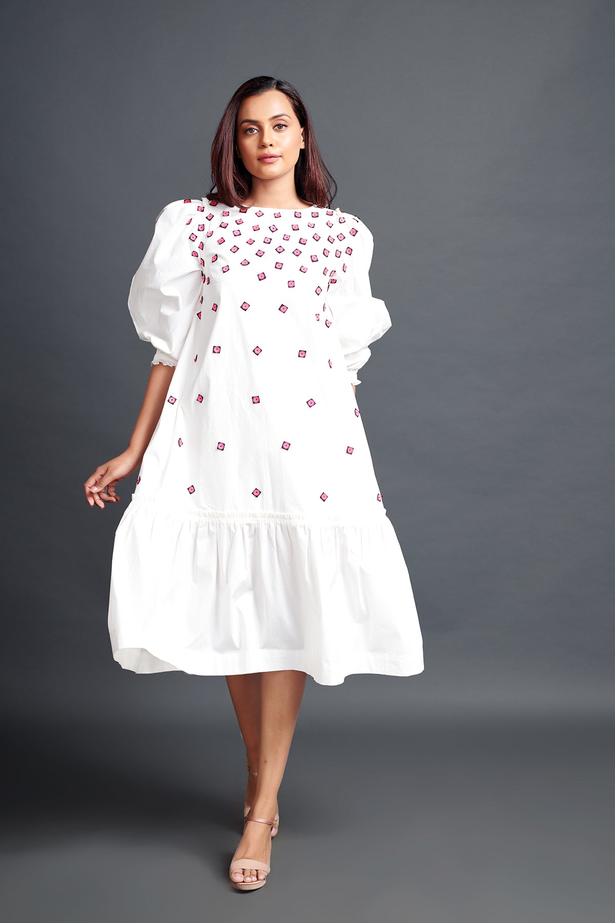 Image of WHITE GATHERED HEM DRESS IN COTTON BASE WITH CUTWORK EMBROIDERY. From savoirfashions.com