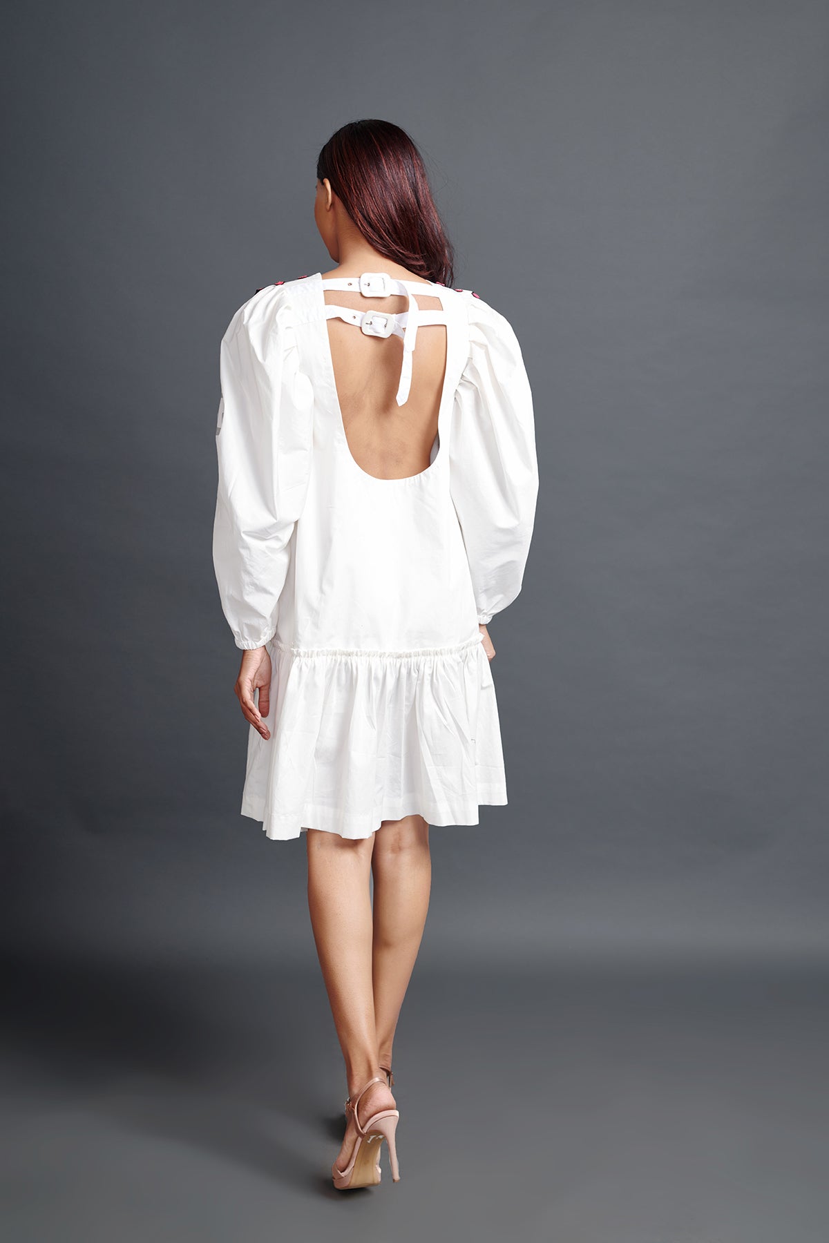 Image of WHITE GATHERED BACKLESS DRESS IN COTTON BASE WITH CUTWORK EMBROIDERY. From savoirfashions.com