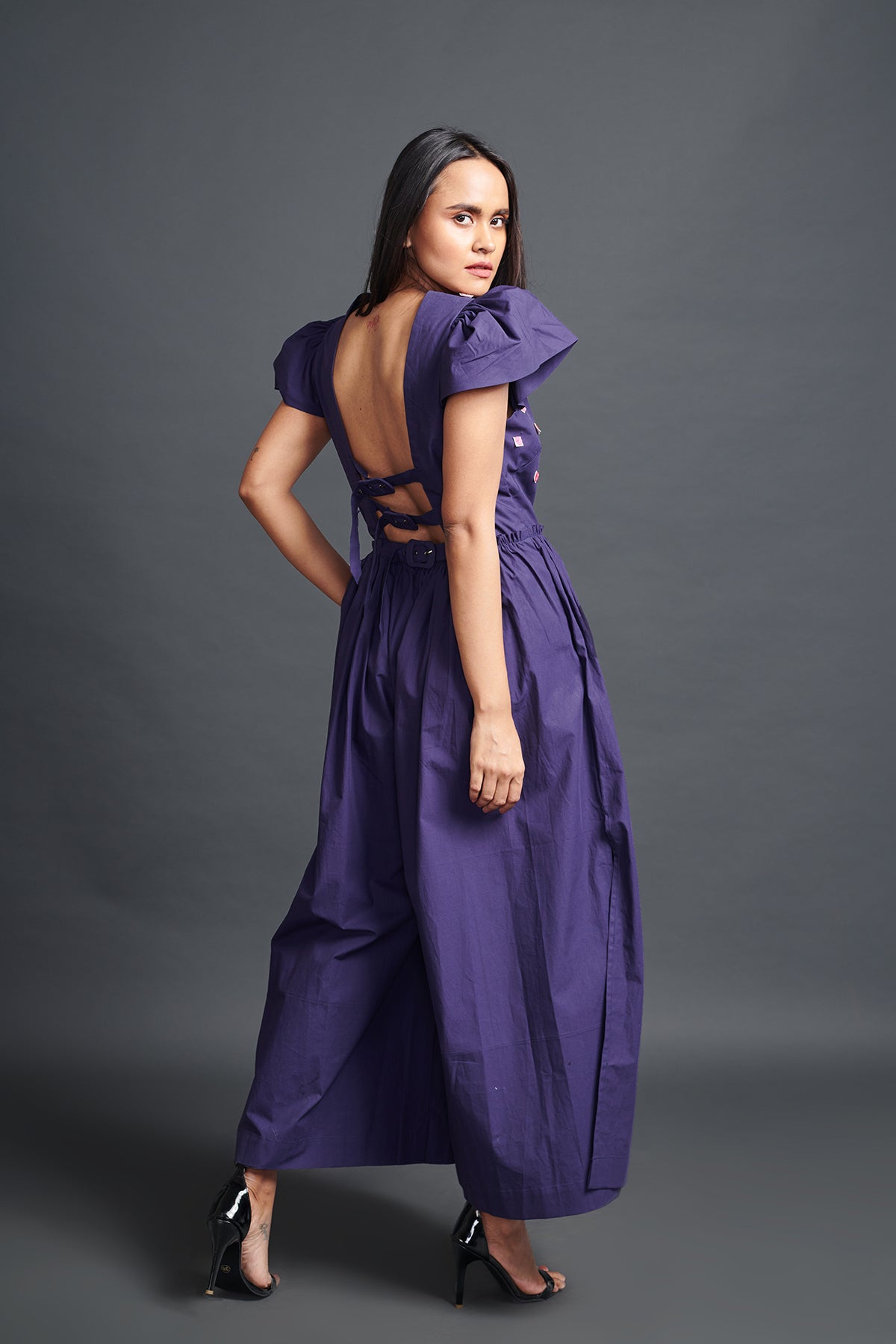 Image of PURPLE BACKLESS JUMPSUIT IN COTTON BASE WITH CUTWORK EMBROIDERY. From savoirfashions.com