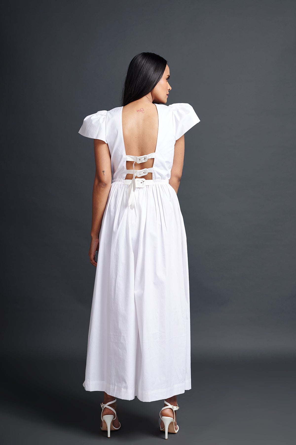 Image of WHITE BACKLESS JUMPSUIT IN COTTON BASE WITH CUTWORK EMBROIDERY. From savoirfashions.com