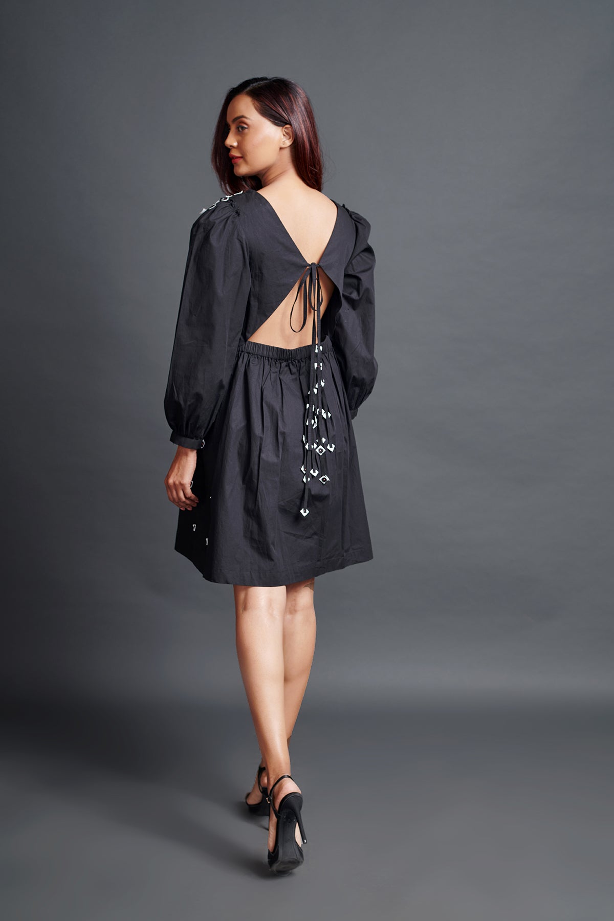 Image of BLACK A-LINE DRESS IN COTTON BASE WITH EMBROIDERY AND BACK KNOT DETAIL. From savoirfashions.com