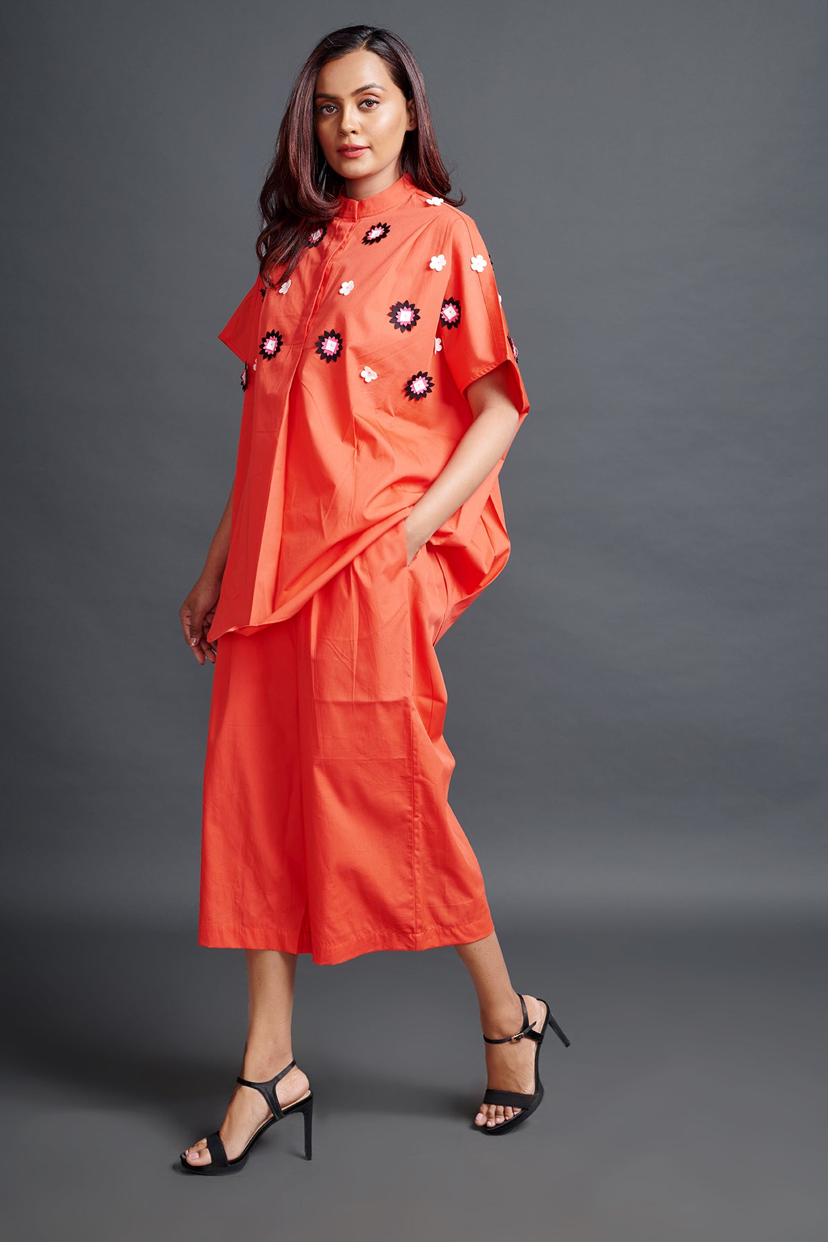 Image of ORANGE OVERSIZED SHIRT IN COTTON BASE WITH CUTWORK EMBROIDERY. IT IS PAIRED WITH MATCHING PANTS. From savoirfashions.com