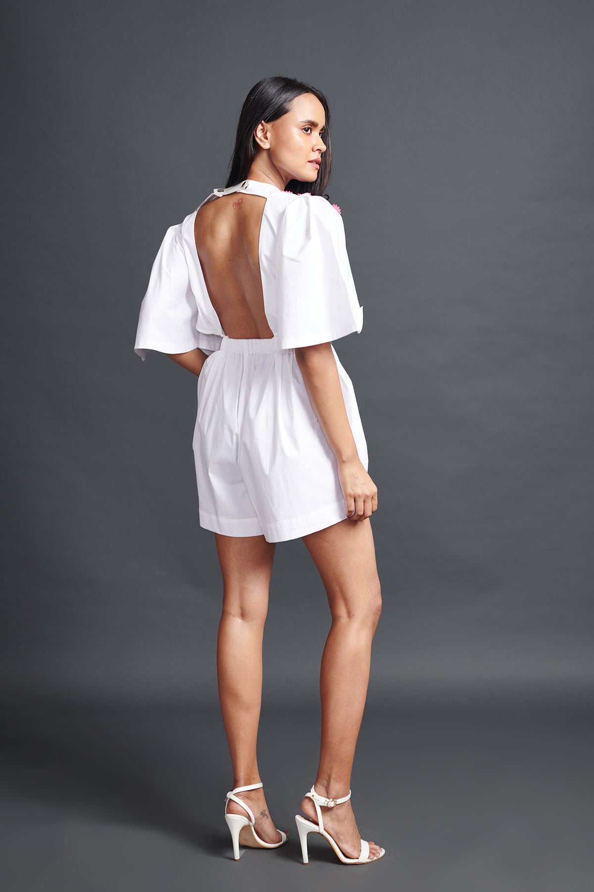 Image of WHITE PLAYSUIT IN COTTON BASE WITH CUTWORK EMBROIDERY AND BACKLESS SIDE CUT-OUT DETAIL. From savoirfashions.com