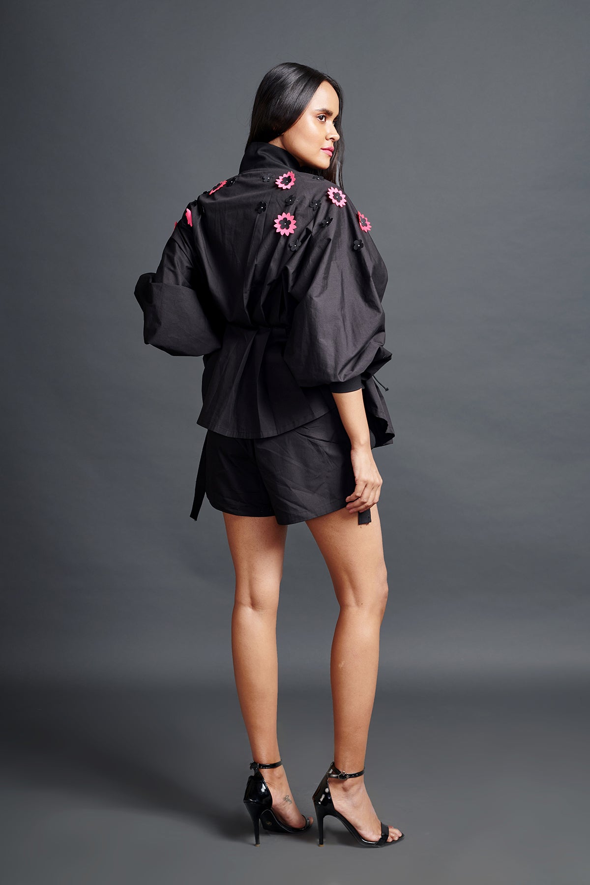 Image of BLACK SHIRT IN COTTON BASE WITH PLEATED CONFETTI DETAIL. IT IS PAIRED WITH MATCHING SHORTS. From savoirfashions.com