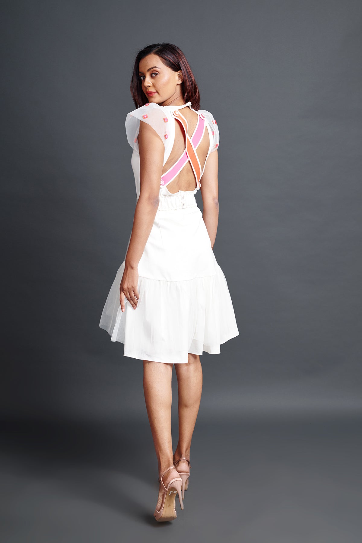 mage of WHITE NEON CROSS BODYSUIT WITH HIGH LOW SKIRT. From savoirfashions.com