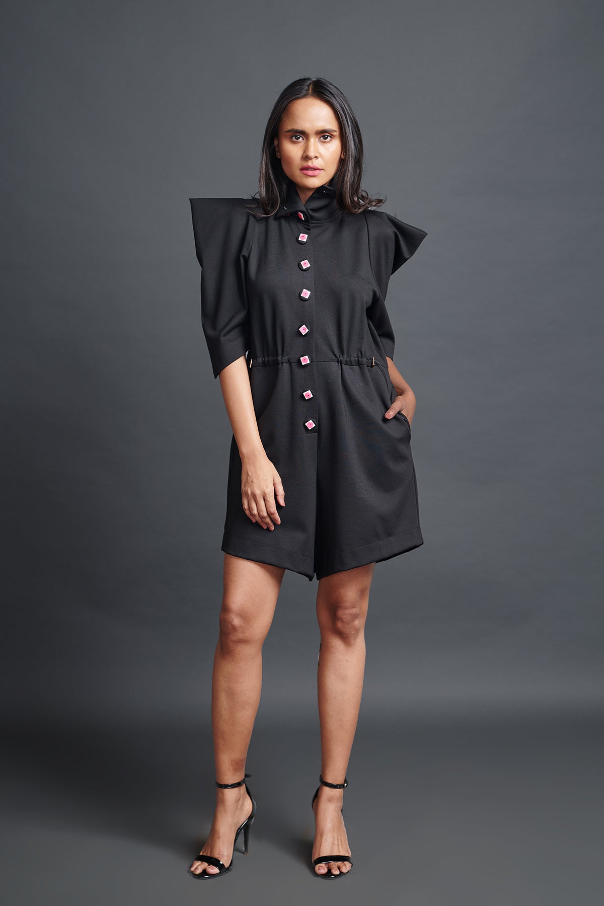 Image of BLACK HIGH NECK PLAYSUIT WITH CUT WORK NEON BUTTONS. From savoirfashions.com