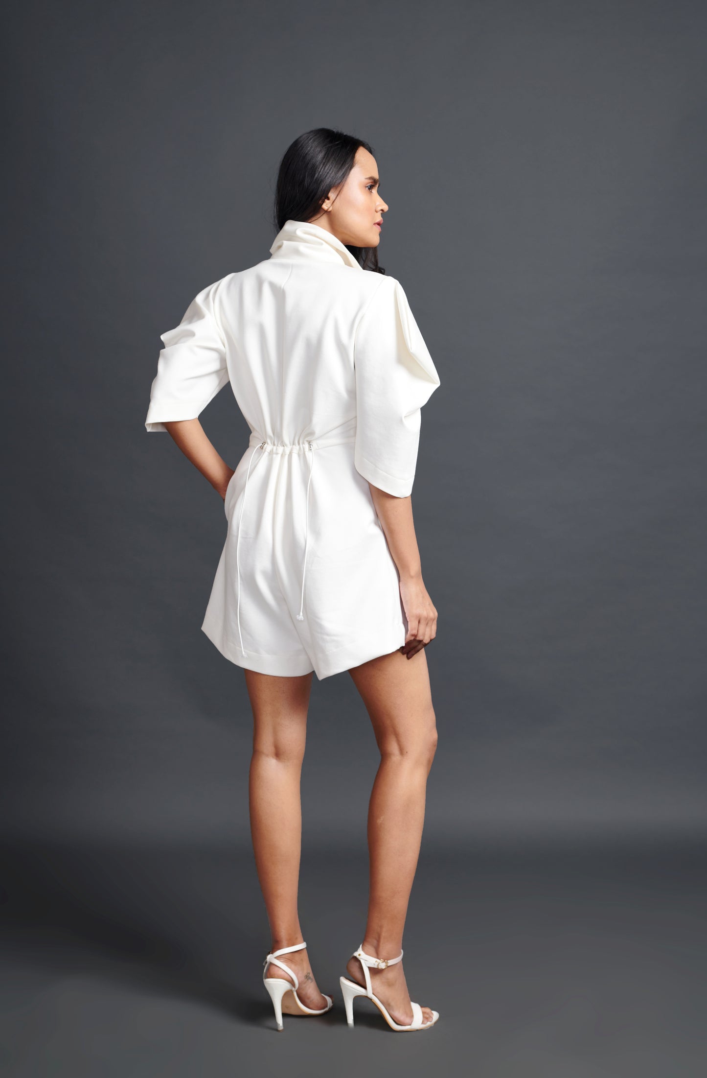 Image of WHITE HIGH NECK PLAYSUIT WITH CUT WORK NEON BUTTONS. From savoirfashions.com