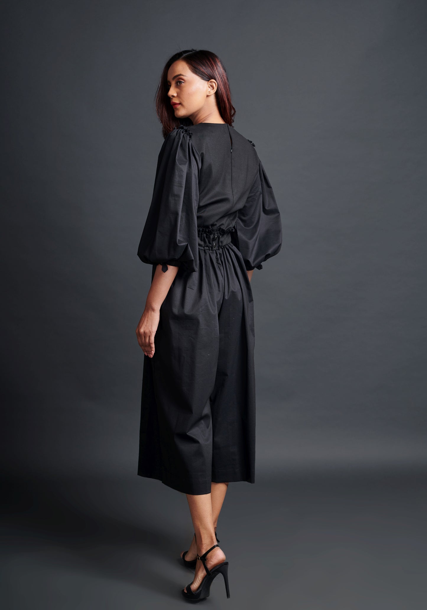 Image of BLACK MONOCROM JUMPSUIT WITH NEOE CONFETTI BELT. From savoirfashions.com