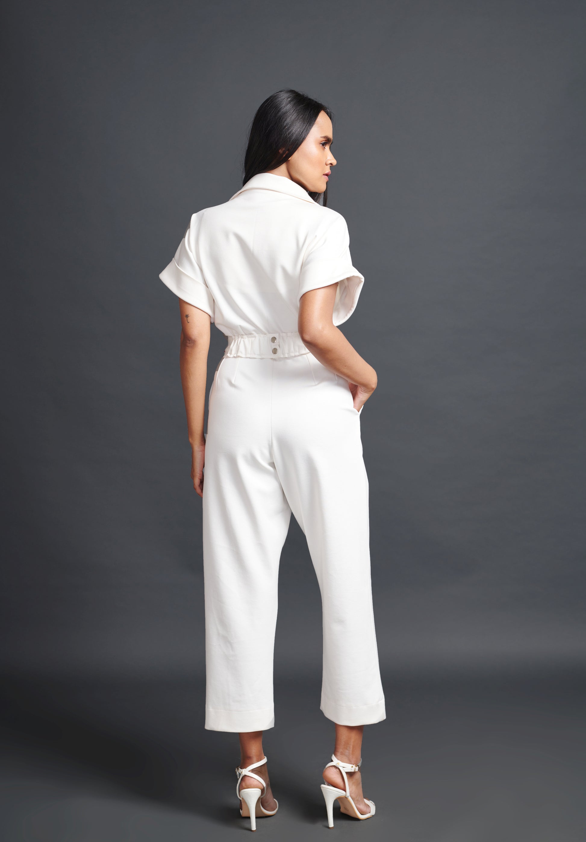 Image of WHITE COLLARED JUMPSUIT WITH NEION CONFETTI BELT. From savoirfashions.com