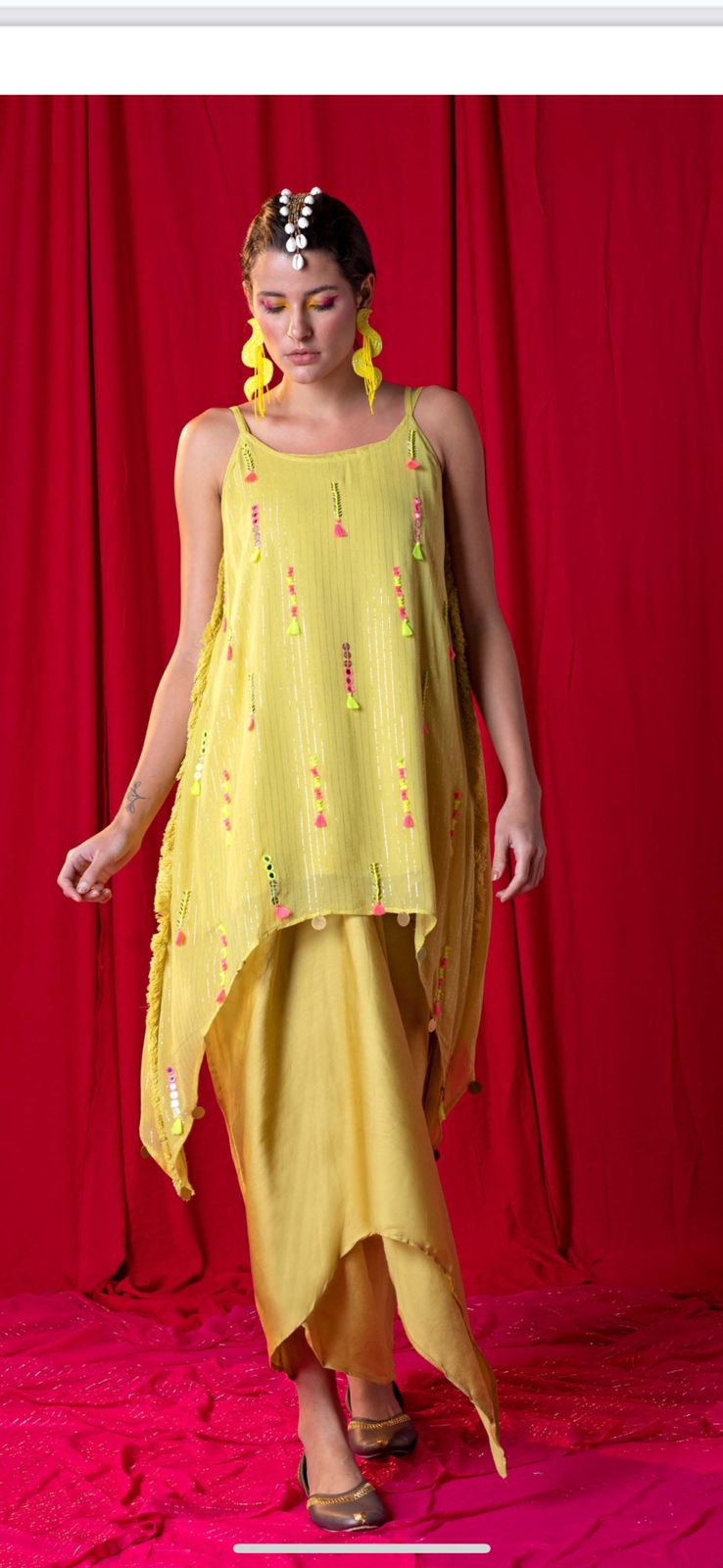 Image of This stylish Yellow Spaghetti Tunic Twin Set is perfect for making a statement. Expertly crafted from a lightweight, airy fabric and embellished with mirror details and multi-color tassels, this look is complete with a draped skirt. A truly unique and fashionable ensemble.  From savoirfashions.com