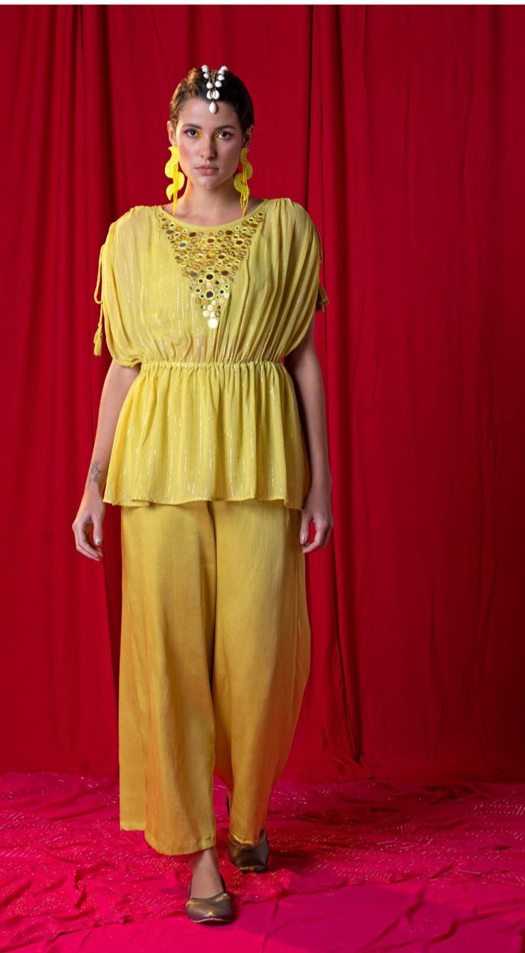 Image of This Yellow Peplum Kimono Twin Set is designed with mirror and metallic embroidery, paired with a Palazzo Pant for a fashionable look. The kimono is lightweight and comfortable, making it perfect for all-day wear. The unique pattern is sure to turn heads.  From savoirfashions.com