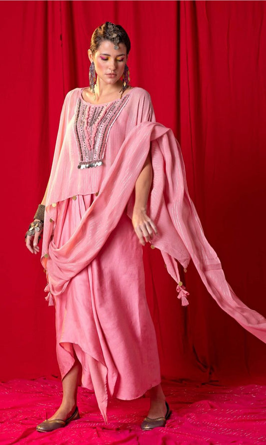 Image of This MOOSE Pink Cape Skirt Sari stands out with its georgette cape embellished with metallic and mirror embroidery. It is paired with a draped skirt and an attached dupatta for an elegant ensemble that is sure to turn heads. Its fine fabric and intricate detailing make it a showstopper.  From savoirfashions.com