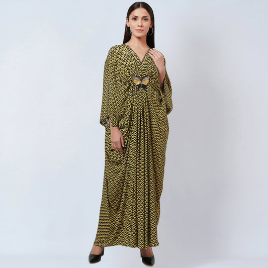 Image of This full length kaftan is crafted from 100% silk with a striking fluorescent yellow honeycomb print. The kaftan is finished with beautiful butterfly motifs, creating a luxurious and eye-catching look.  From savoirfashions.com