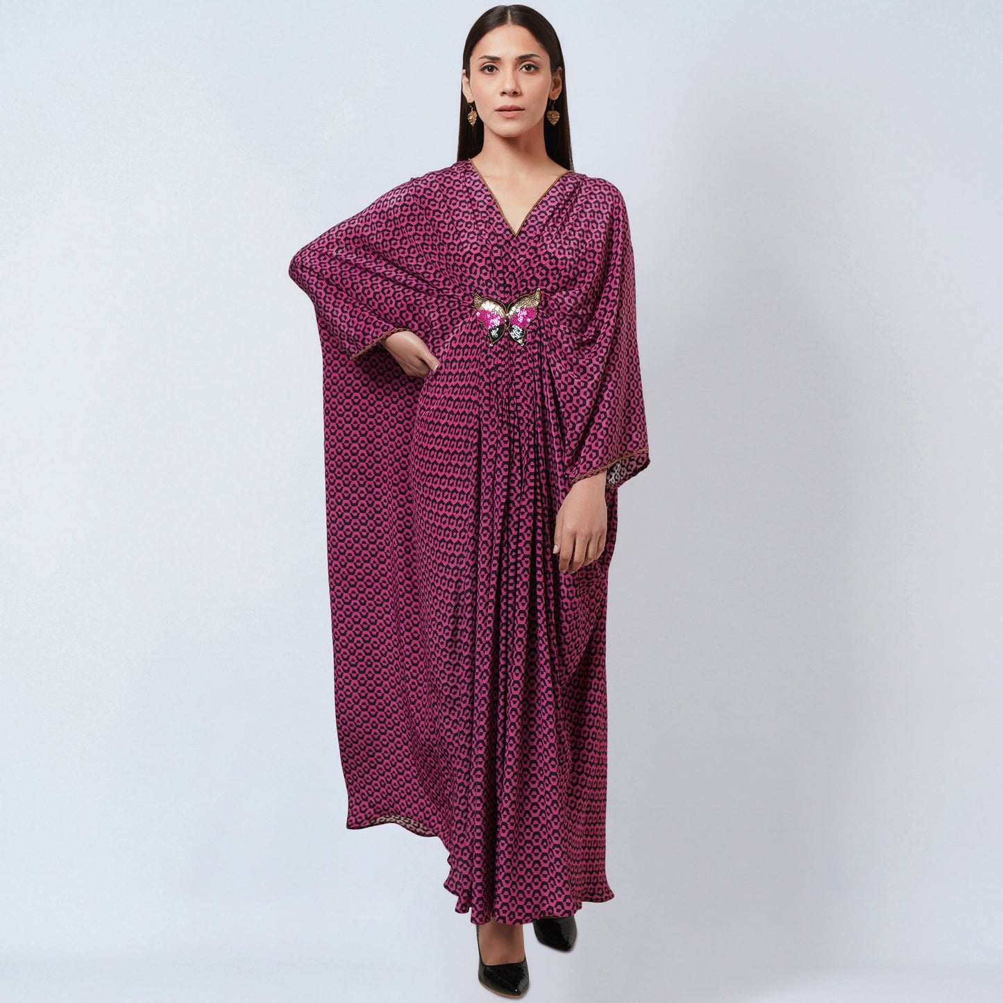 Image of Look stunning in this MAGENTA HONEYCOMB PRINT SILK FULL LENGTH KAFTAN WITH BUTTERFLY MOTIF from our Kaftan Collection. Crafted from lightweight silk, this full-length kaftan is decorated with an intricately patterned honeycomb print and a delicate butterfly motif. It's sure to elevate your formal wardrobe.  From savoirfashions.com