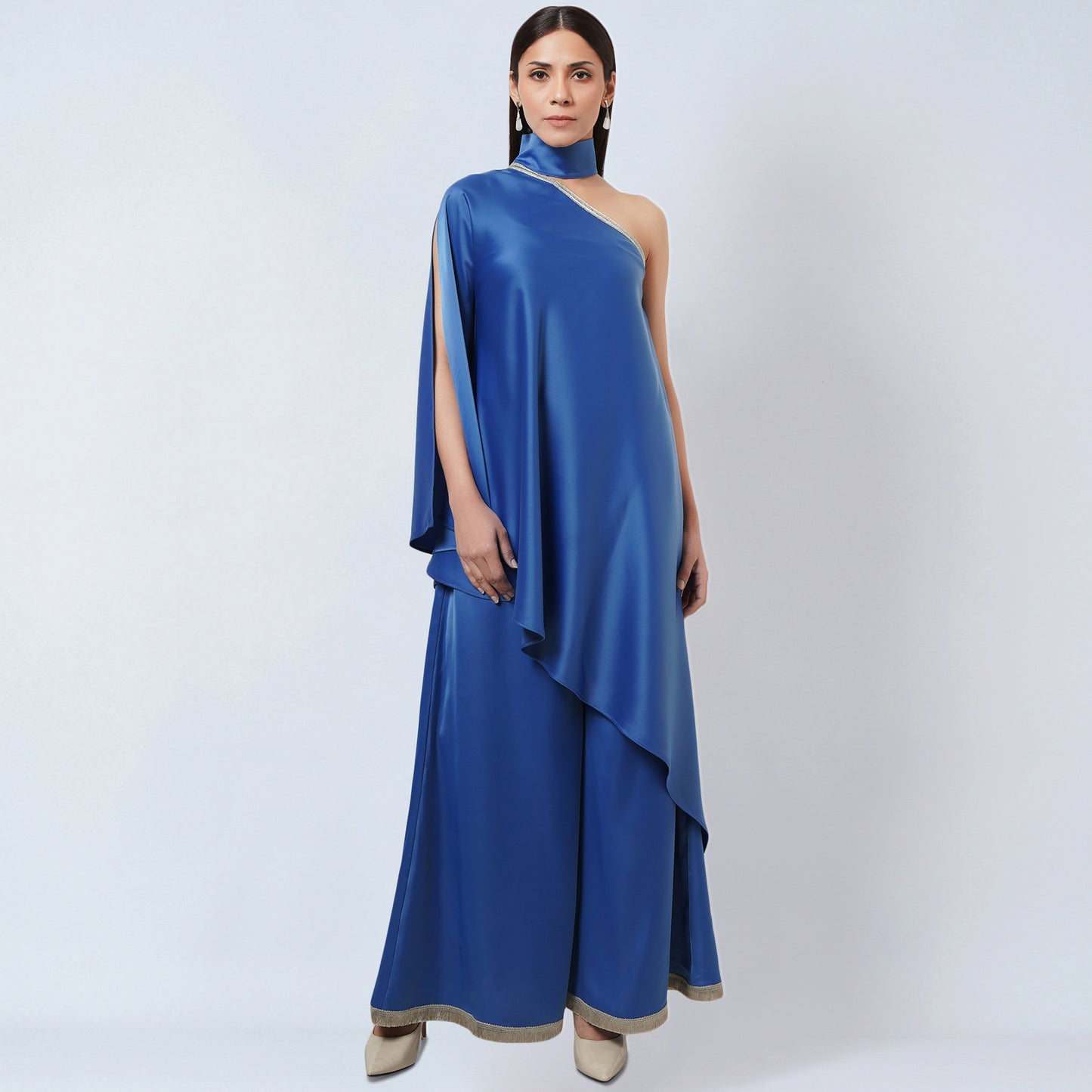 Image of This BLUE ONE-SHOULDER ASYMMETRIC TUNIC AND WIDE LEG PANTS set from our collection features a unique one-shoulder tunic and wide-leg pants. This eye-catching set is ideal for making a statement with its asymmetrical style and timeless design.  From savoirfashions.com