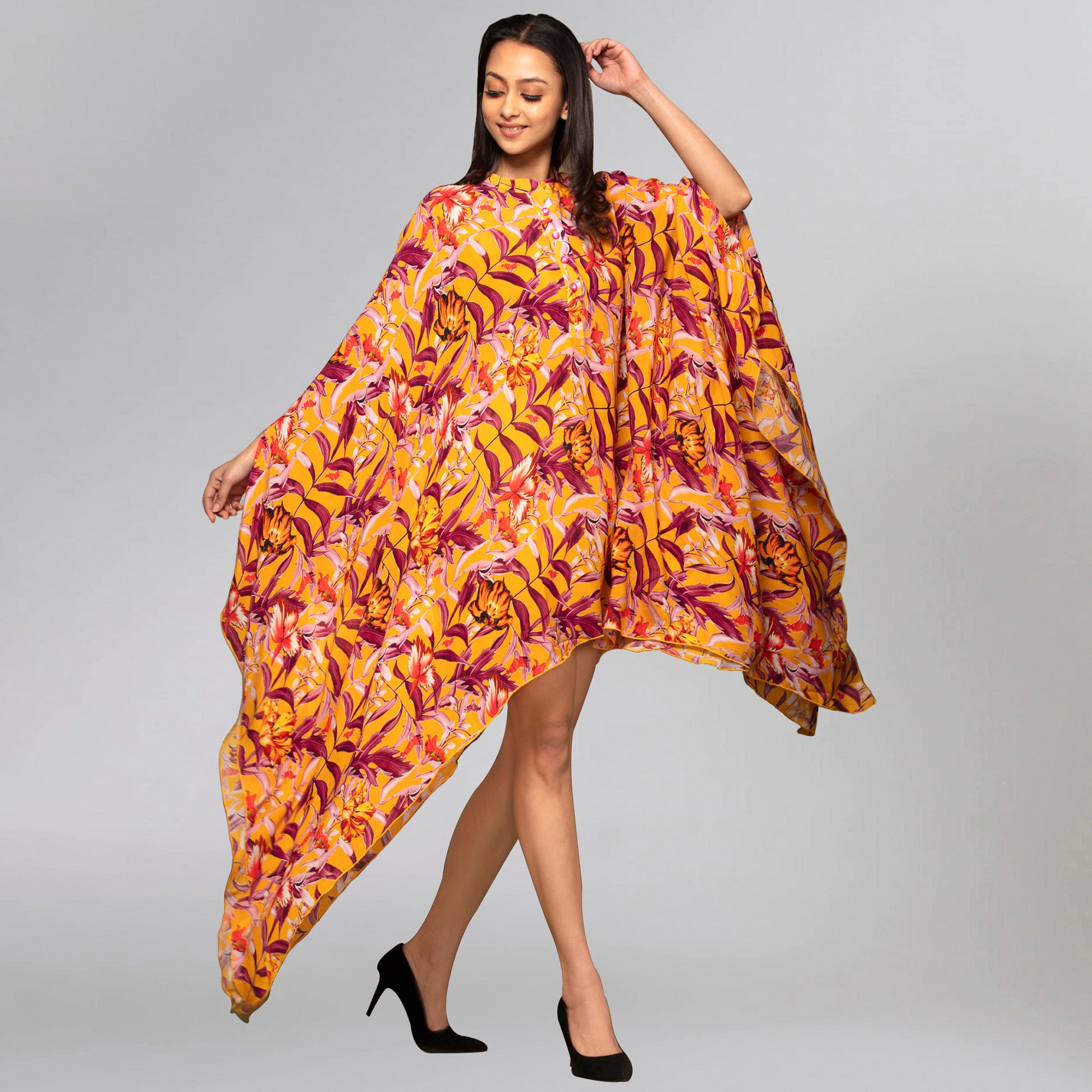 Image of This YELLOW TROPICAL PRINT KAFTAN is the perfect addition to your KAFTAN collection. Made from a high-quality fabric blend, it offers a lightweight and breathable feel for maximum comfort. The bold tropical print is sure to turn heads. From savoirfashions.com