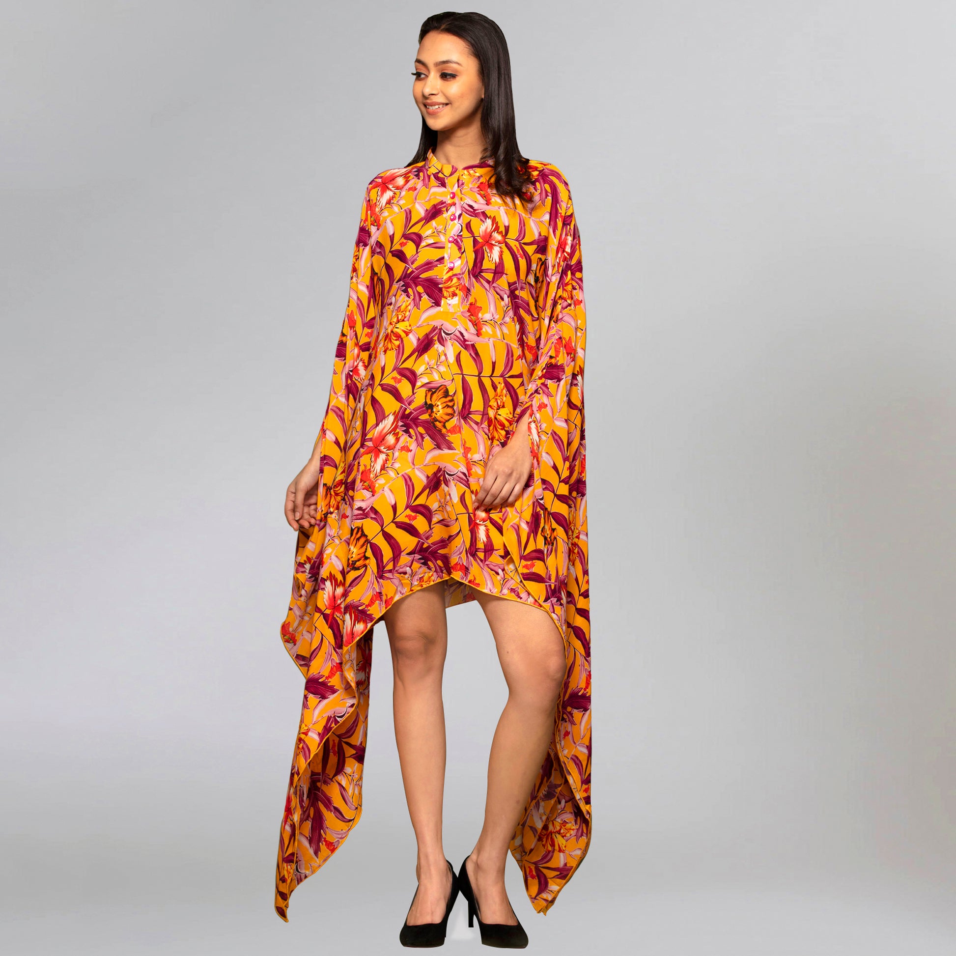 Image of This YELLOW TROPICAL PRINT KAFTAN is the perfect addition to your KAFTAN collection. Made from a high-quality fabric blend, it offers a lightweight and breathable feel for maximum comfort. The bold tropical print is sure to turn heads.  From savoirfashions.com