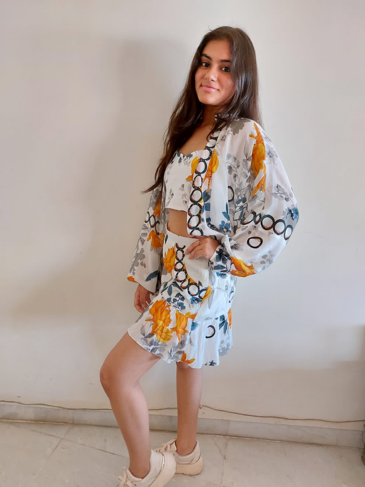 Image of This three-piece set is made with a soft polyester fabric and features a beautiful white and yellow floral print. The coordinating top and bottom is perfect for any occasion, and is sure to be a favourite in any wardrobe.  From savoirfashions.com