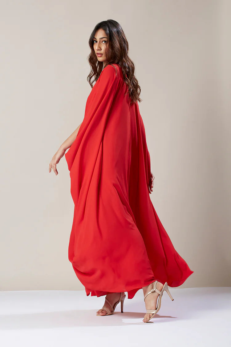 Image of Make a statement in this stunning Red Floor Length Kaftan Dress. Crafted from smooth fabric with an eye-catching print, this dress is sure to turn heads. The softly gathered neckline, long flowing sleeves, and full skirt provide maximum coverage and a flattering silhouette. Perfect for special occasions or a night out. From savoirfashions.com