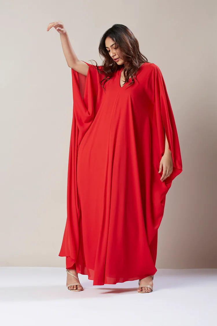 Image of Make a statement in this stunning Red Floor Length Kaftan Dress. Crafted from smooth fabric with an eye-catching print, this dress is sure to turn heads. The softly gathered neckline, long flowing sleeves, and full skirt provide maximum coverage and a flattering silhouette. Perfect for special occasions or a night out.  From savoirfashions.com