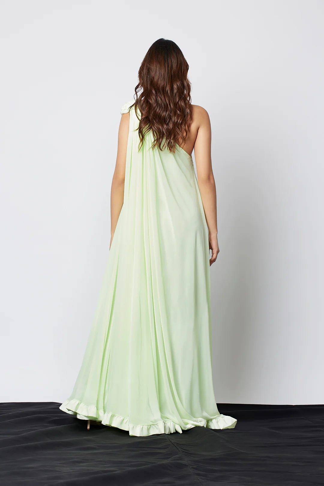 Image of Enhance your wardrobe with our Light Mint Green Georgette Blend One Shoulder Maxi Dress. Crafted from a georgette blend, this stunning maxi dress features one shoulder detail and an elegant design. Perfect for any occasion, this high-quality dress can be dressed up or down. . From savoirfashions.com