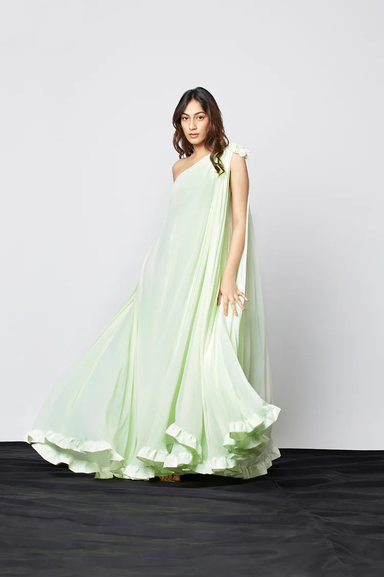 Image of Enhance your wardrobe with our Light Mint Green Georgette Blend One Shoulder Maxi Dress. Crafted from a georgette blend, this stunning maxi dress features one shoulder detail and an elegant design. Perfect for any occasion, this high-quality dress can be dressed up or down.  .  From savoirfashions.com