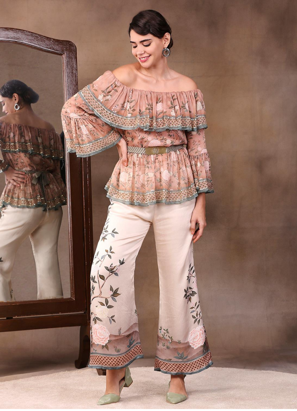 This stylish off shoulder top and palazzo combo is perfect for casual chic occasions. The lightweight fabric and comfortable fit of the top and pant make them extremely comfortable to wear. The off shoulder design gives the ensemble a unique look. Enjoy effortless style in this modern yet timeless design.  From savoirfashions.com