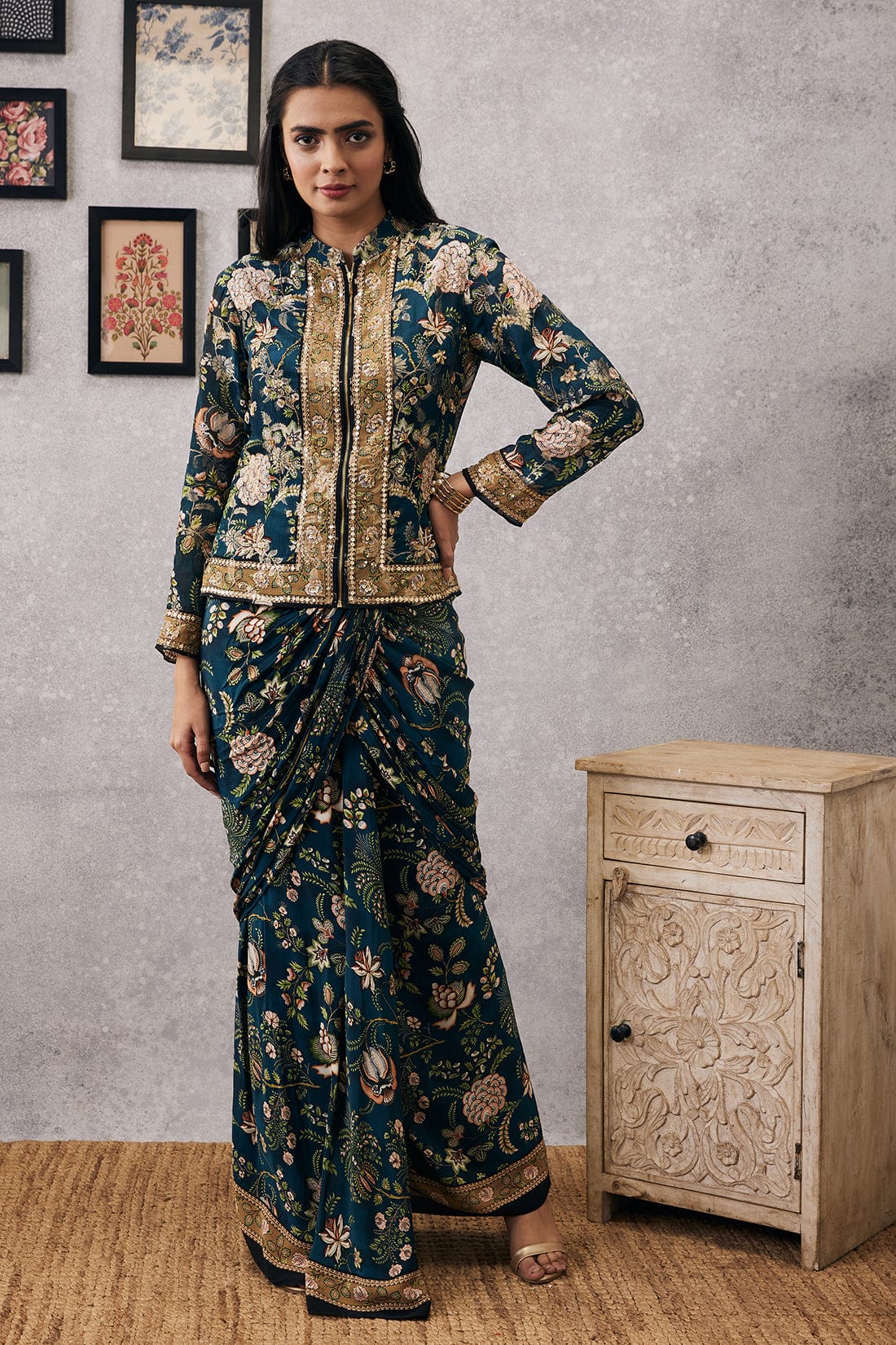 Image of The MEHR Embroidered Jacket with Drape Skirt is a unique and stylish choice for formal attire. The embroidery proudly displays intricate designs along the entire jacket and skirt, crafted from quality fabrics for a flattering, yet comfortable fit. The drape skirt adds an extra layer of elegance while still remaining lightweight and breathable for any occasion.  From savoirfashions.com