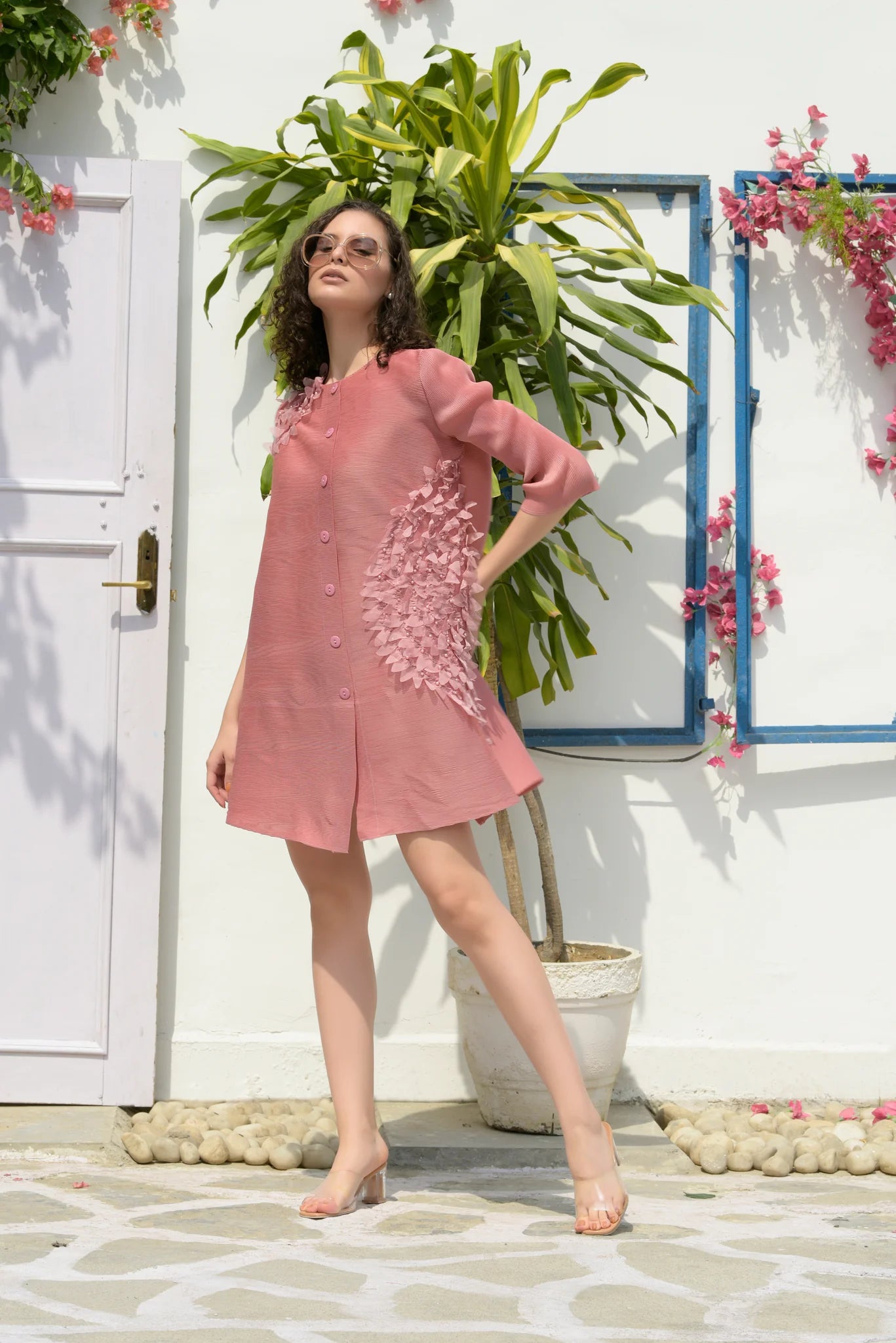 Image of Show off your unique style with our DAINTY PEARL FEATHER SHIRT DRESS– PINK. This dress is part of our Casual & Brunch Collection, featuring a stunning pink design with dainty pearl feather accents. This design is perfect for any occasion.  From savoirfashions.com