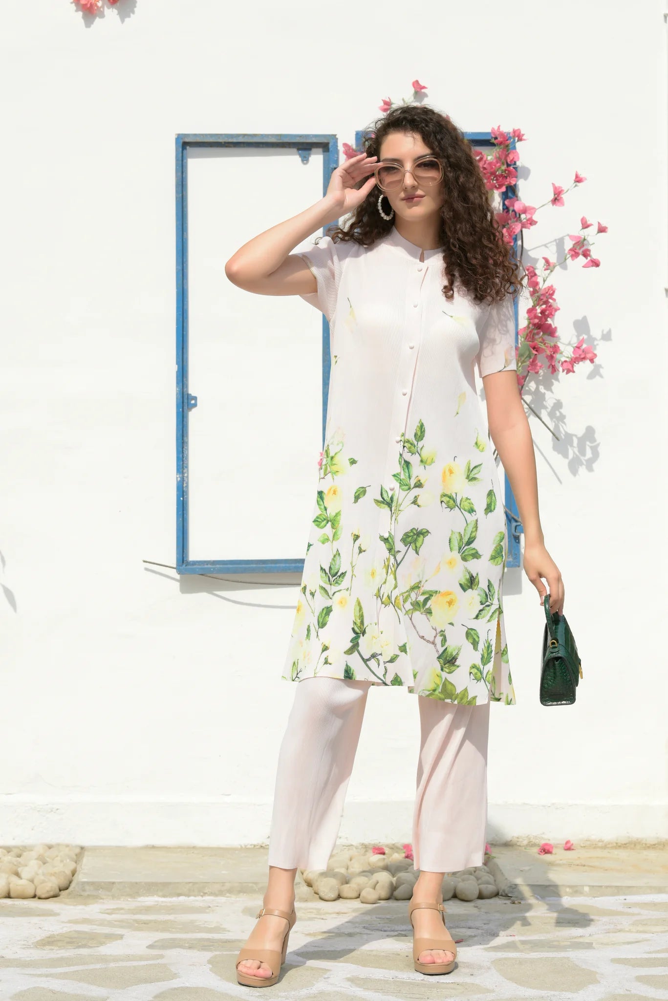 Image of The Fable Floral Tunic Set is designed with the highest quality craftsmanship to bring timeless elegance to your wardrobe. Crafted from rayon fabric, this set ensures breathability and comfort for all-day wear. It features a round neckline, short sleeve cut, and a flattering silhouette that suits all body types. Get ready to look and feel your best with the Fable Floral Tunic Set.  From savoirfashions.com