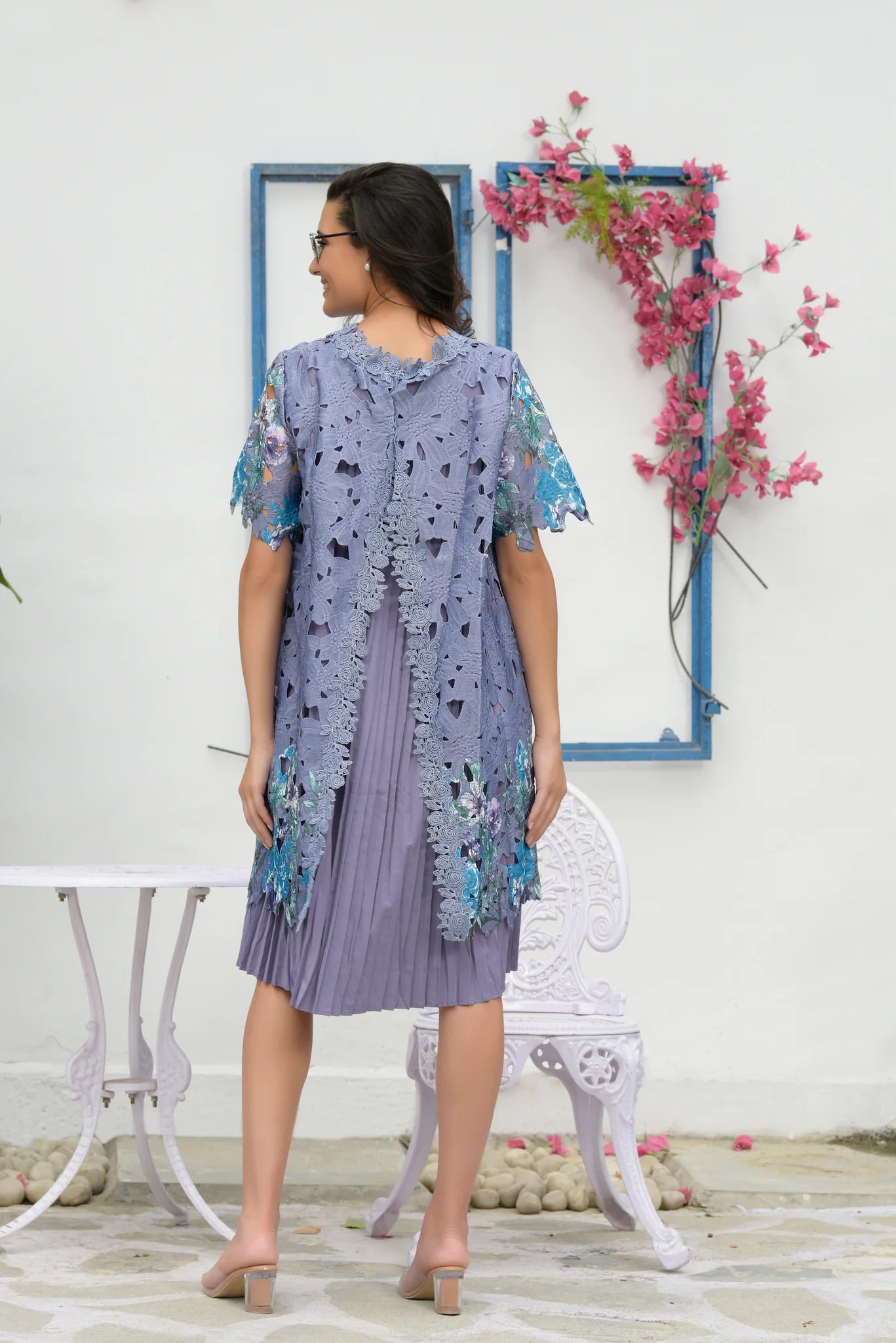 Image of The MYRA MESH IRIS LACE DRESS- LAVENDER exudes sophistication and style. The lavender color adds a subtle pop of color to your ensemble. The mesh lace construction provides a delicate, breathable feel. Experience exquisite comfort with every wear. From savoirfashions.com