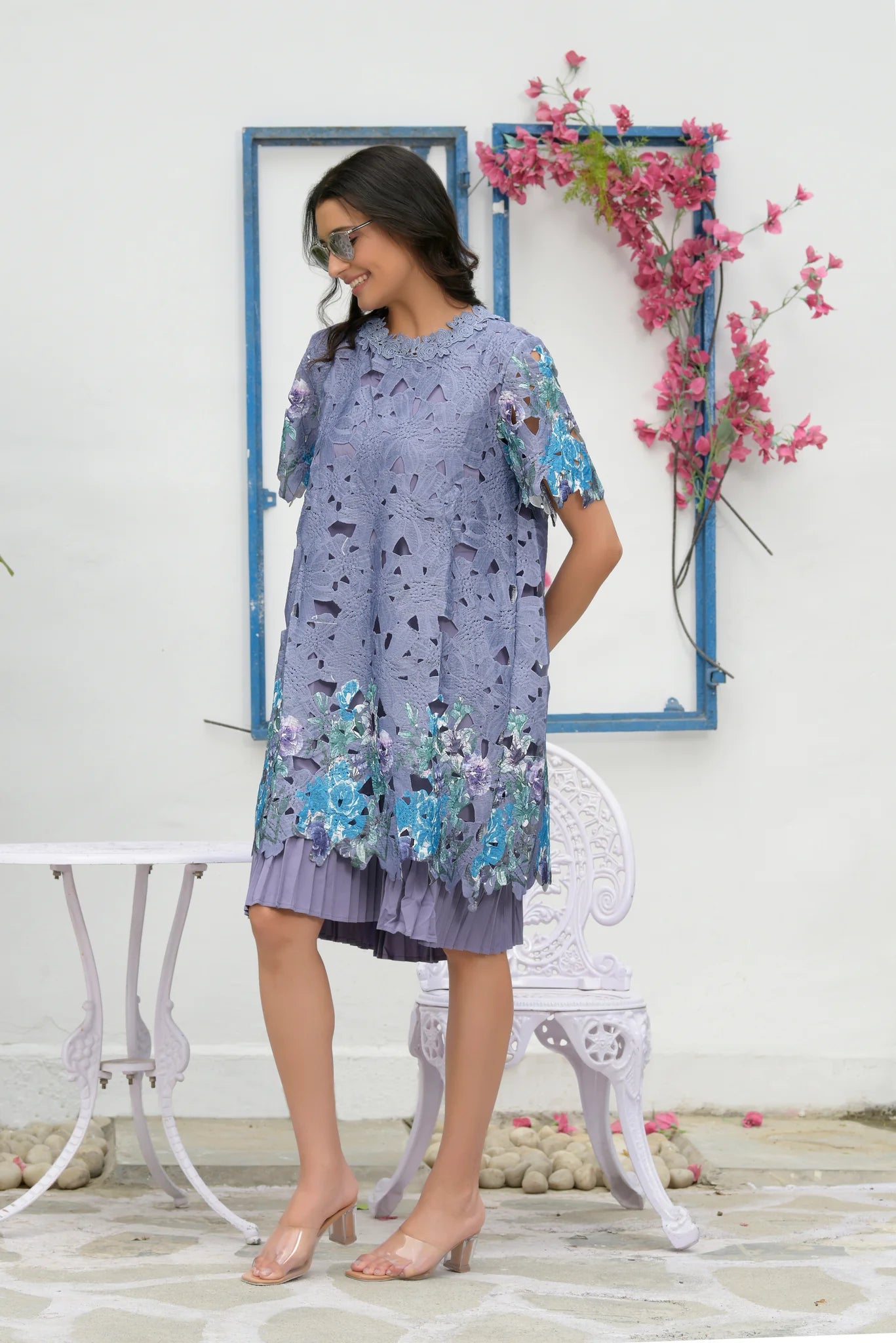 Image of The MYRA MESH IRIS LACE DRESS- LAVENDER exudes sophistication and style. The lavender color adds a subtle pop of color to your ensemble. The mesh lace construction provides a delicate, breathable feel. Experience exquisite comfort with every wear.  From savoirfashions.com